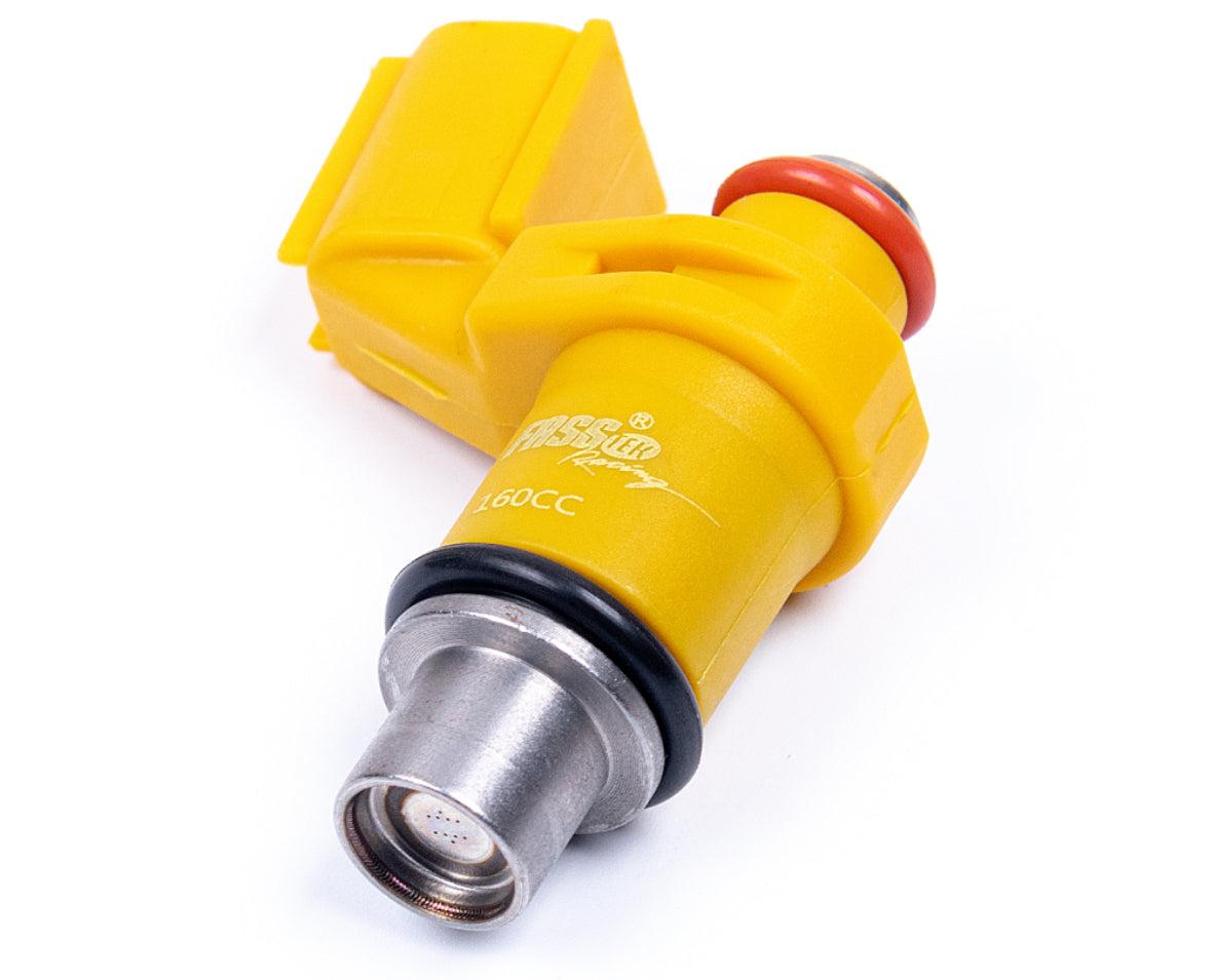 Yellow fuel injector with red cap on a white background